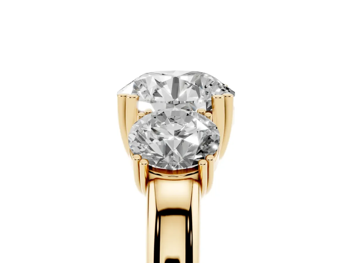 Three-Stone Round Cut Cut Diamond Ring with Channel Set Band and Four-Prong Setting Yellow gold