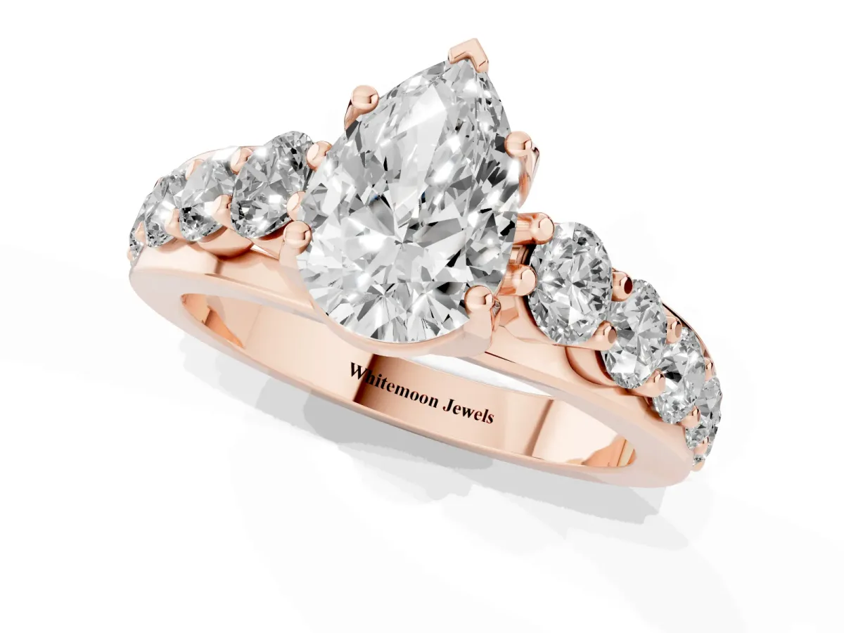 Pear Cut Diamond Engagement Ring with Pavé Band and Four-Prong Setting Rose gold