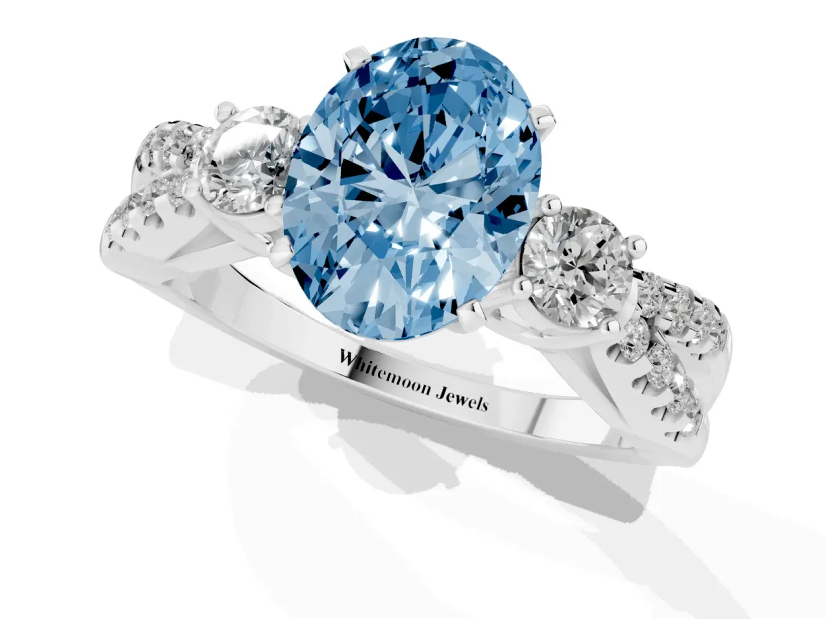 Fancy Blue Oval Cut Diamond Three-Stone Ring with Pavé Split Shank and Four-Prong Setting Silver