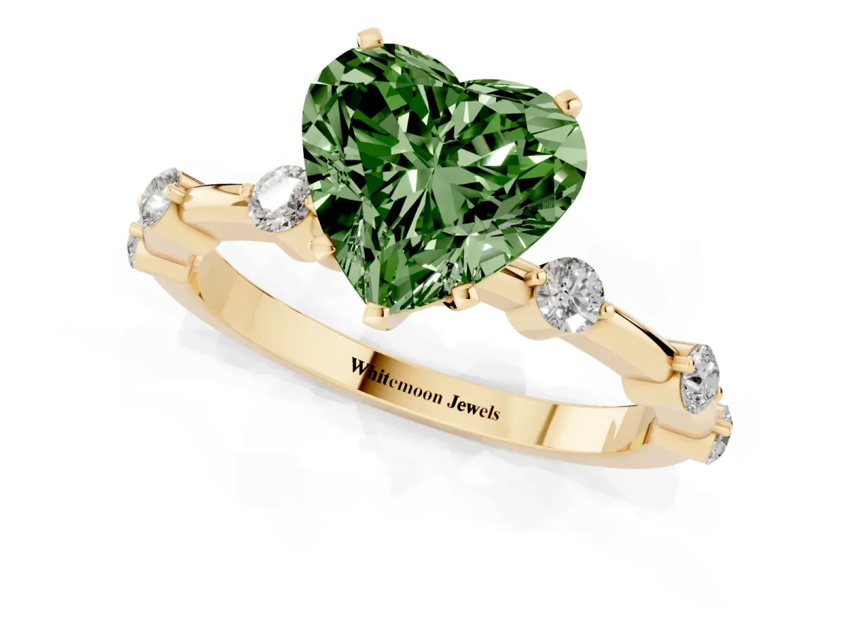 Fancy Green Heart Cut Solitaire Diamond Ring with Bezel Set Side Stones and Prong Setting Yellow gold