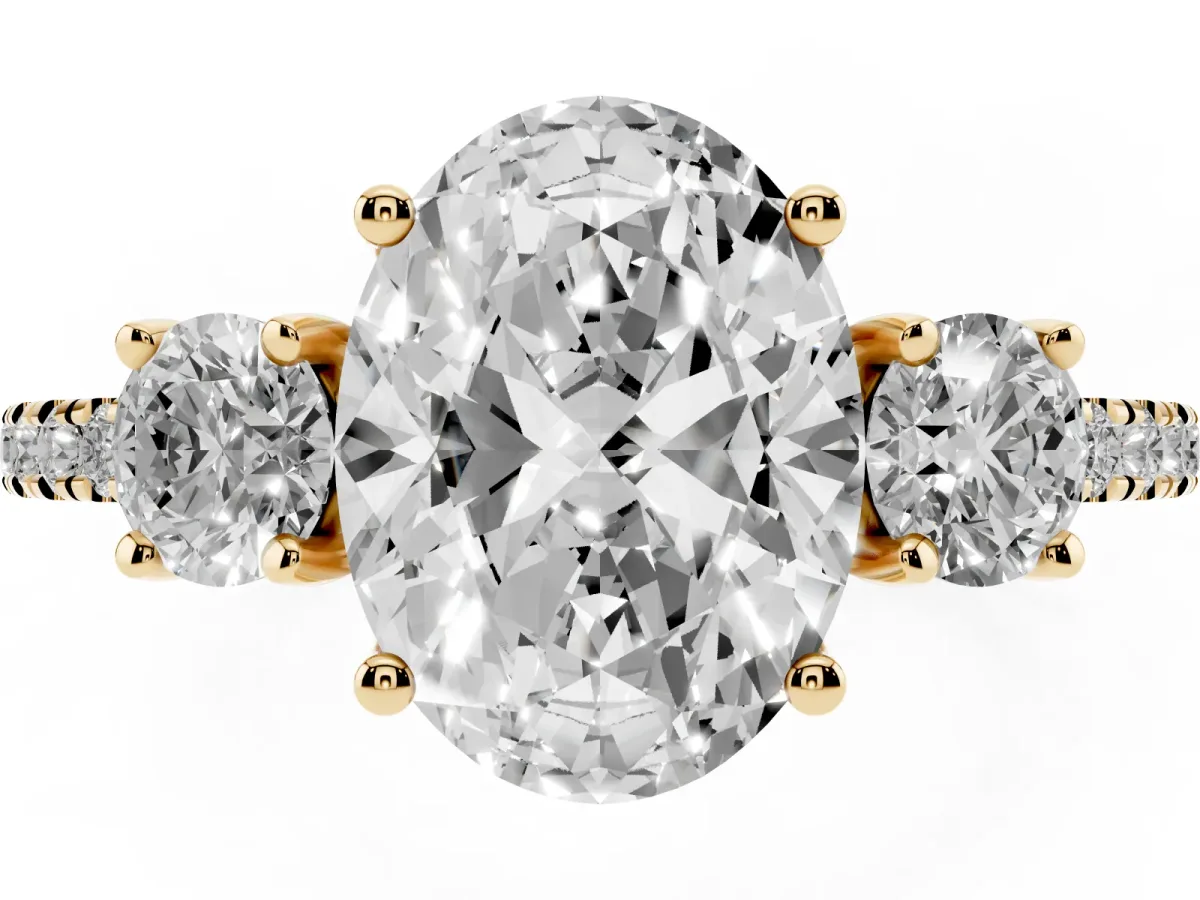 Three-Stone Oval Cut Cut Diamond Pavé Band with Prong Setting Yellow gold