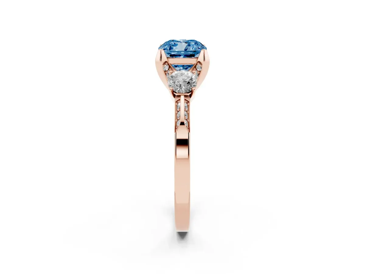 Fancy Blue Cushion Cut Brilliant Three-Stone Diamond Ring with Pavé Band and Four-Prong Setting Rose gold