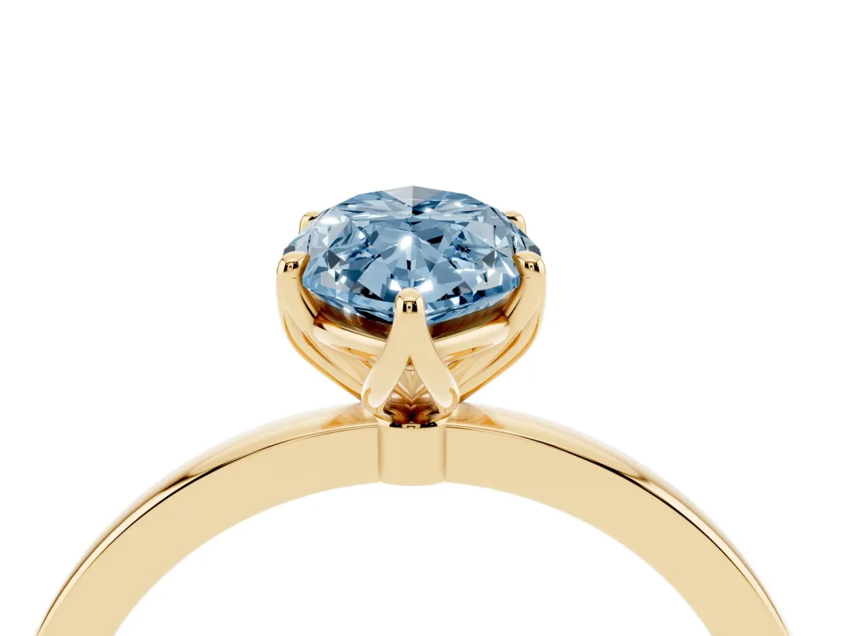 Fancy Blue Marquise Cut Diamond Solitaire Ring with Thin Band and Prong Setting Yellow gold