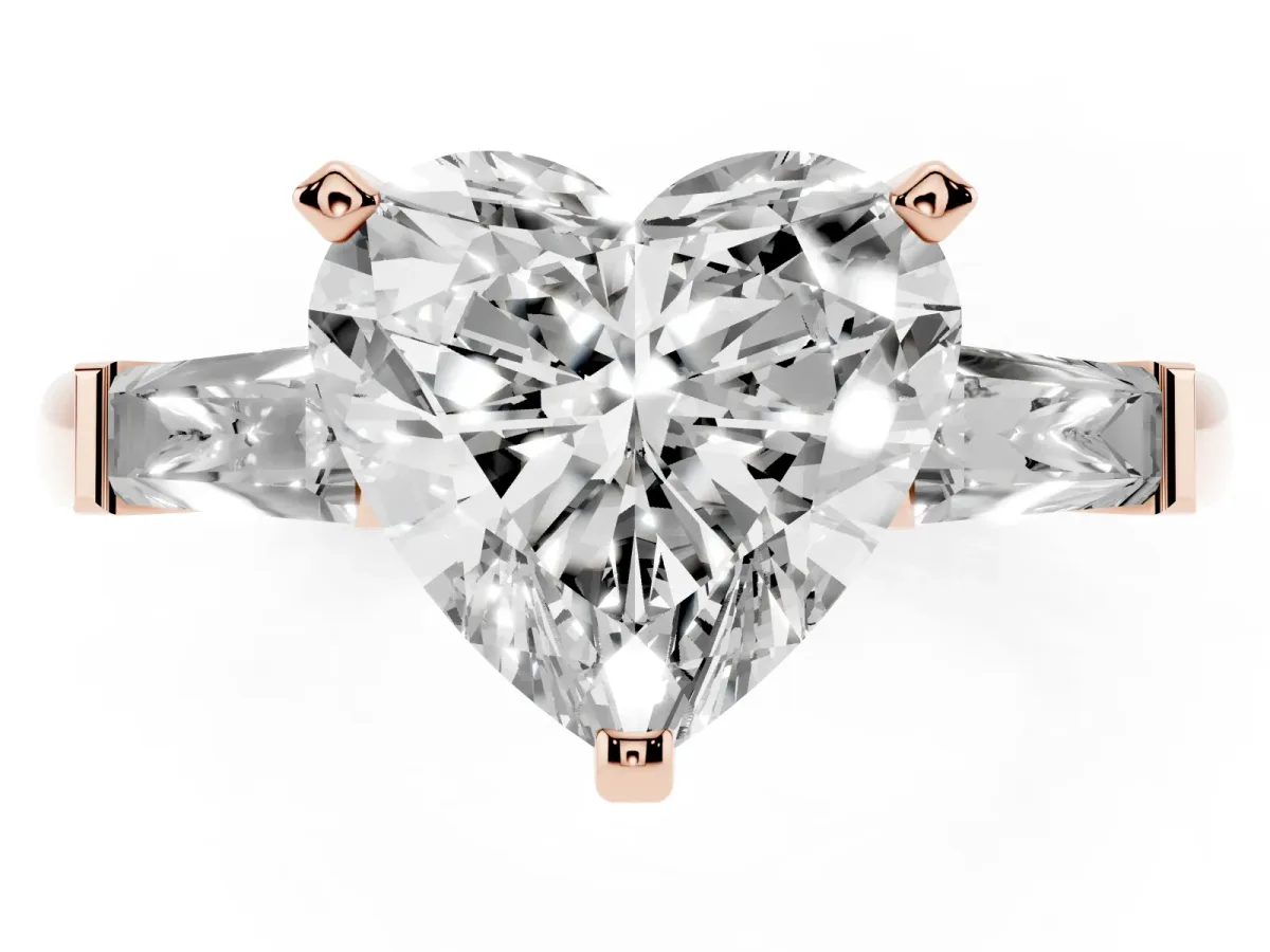 Heart Cut Solitaire with Tapered Baguette Side Stones on a Classic Band with Four-Prong Setting Rose gold