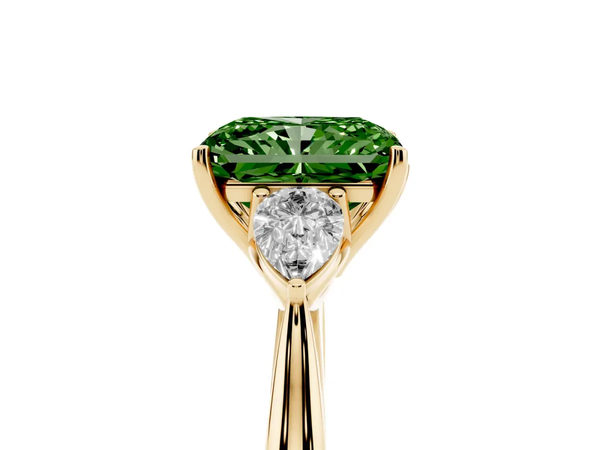 Fancy Green Three-Stone Radiant Cut Diamond Ring with Pear Side Stones in Four-Prong Setting Yellow gold