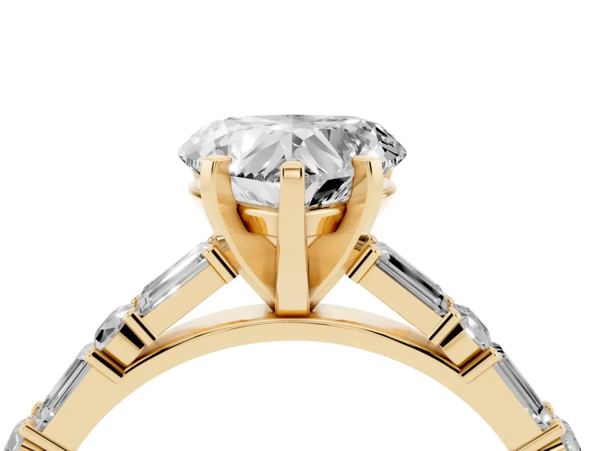 Heart Cut Diamond Solitaire with Side Baguettes and Channel Set Band Yellow gold