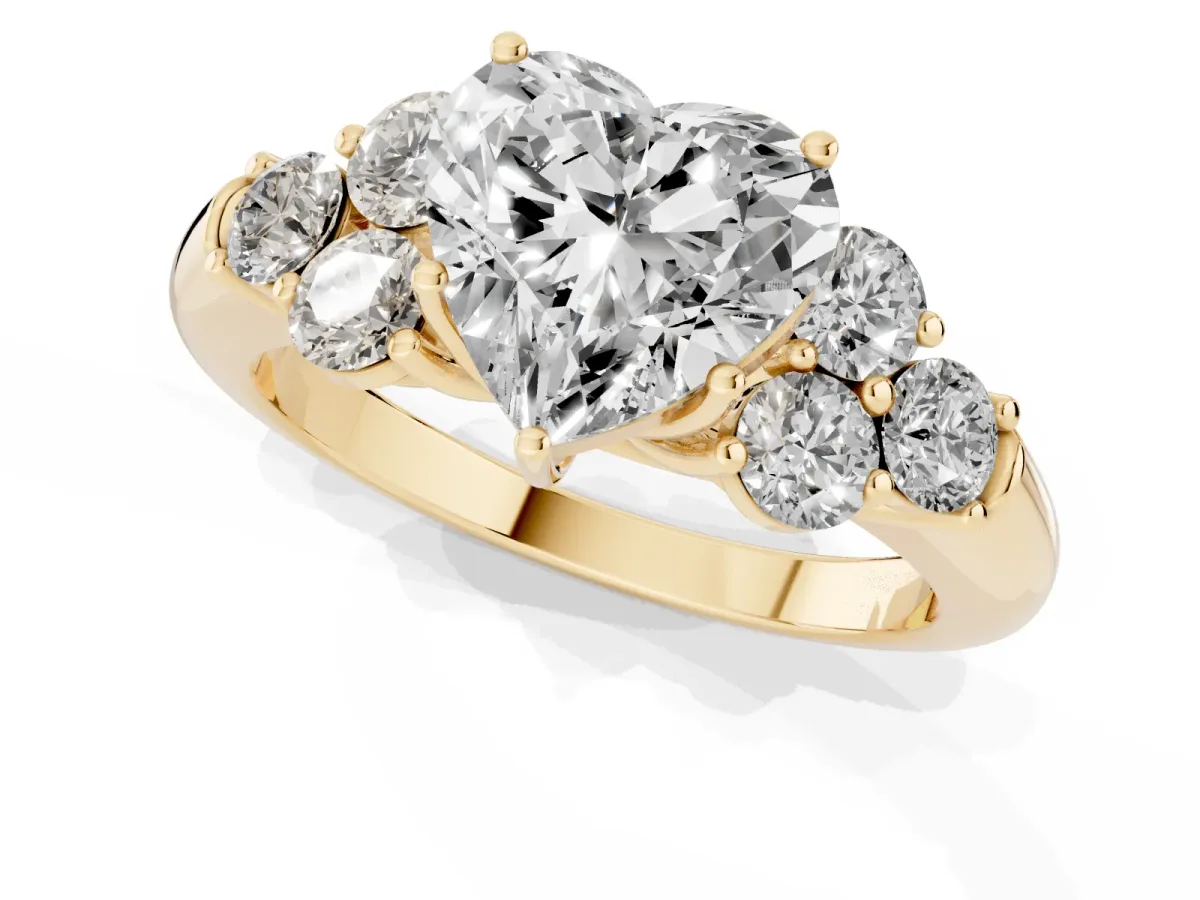Heart Cut Cut Diamond Cluster Ring with Round Accent Stones and Prong Setting on a Classic Band Yellow gold