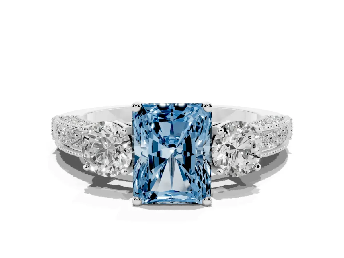 Fancy Blue Radiant Cut Three-Stone Diamond Ring with Pavé Band and Four-Prong Setting Silver