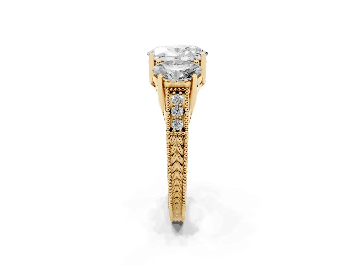 Three-Stone Oval Cut Cut Milgrain Pavé Engagement Ring Yellow gold