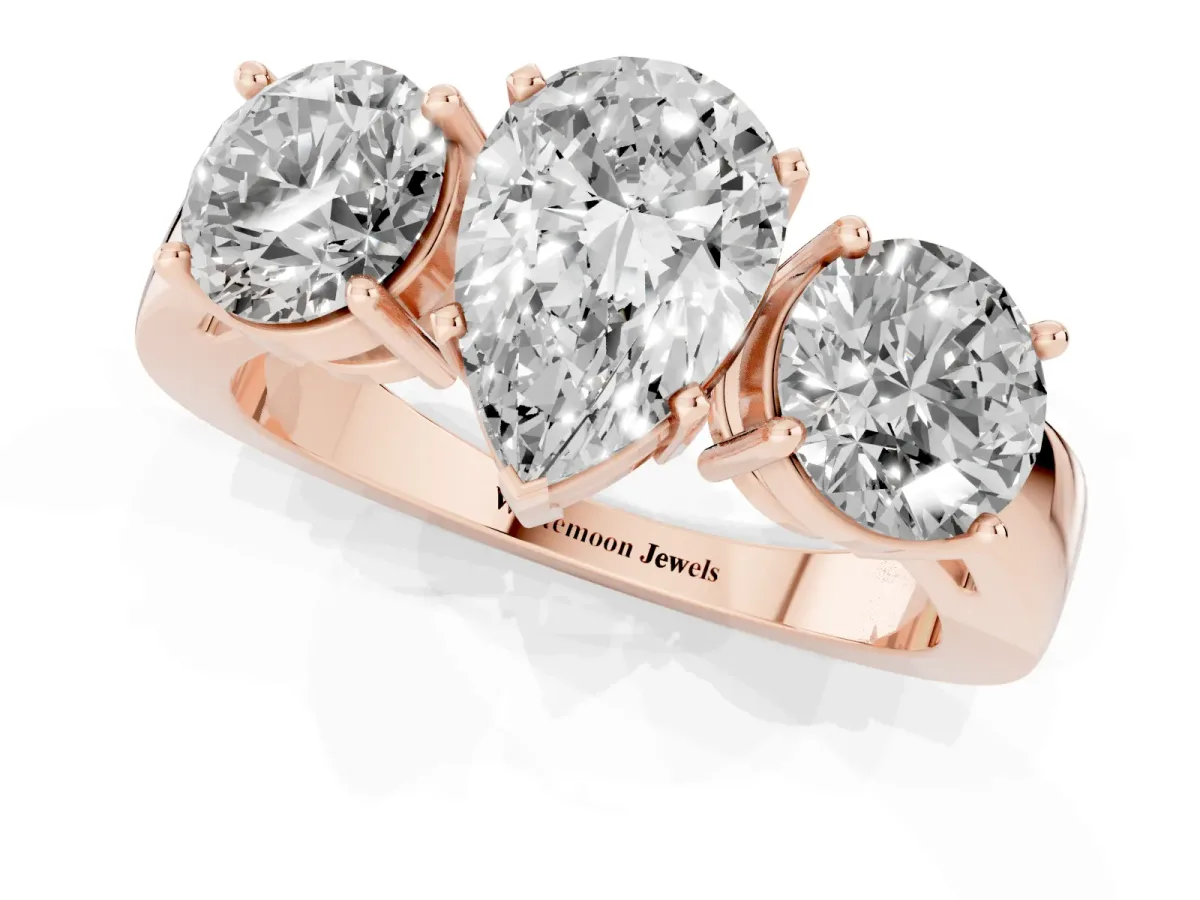Three-Stone Pear Cut Diamond Ring with Round Side Stones, Classic Band, and Four-Prong Setting Rose gold