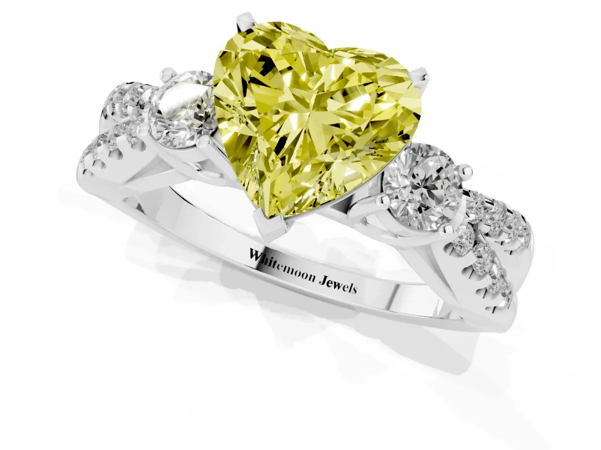 Fancy Yellow Heart Cut Diamond Three-Stone Ring with Pavé Split Shank and Four-Prong Setting Platinum