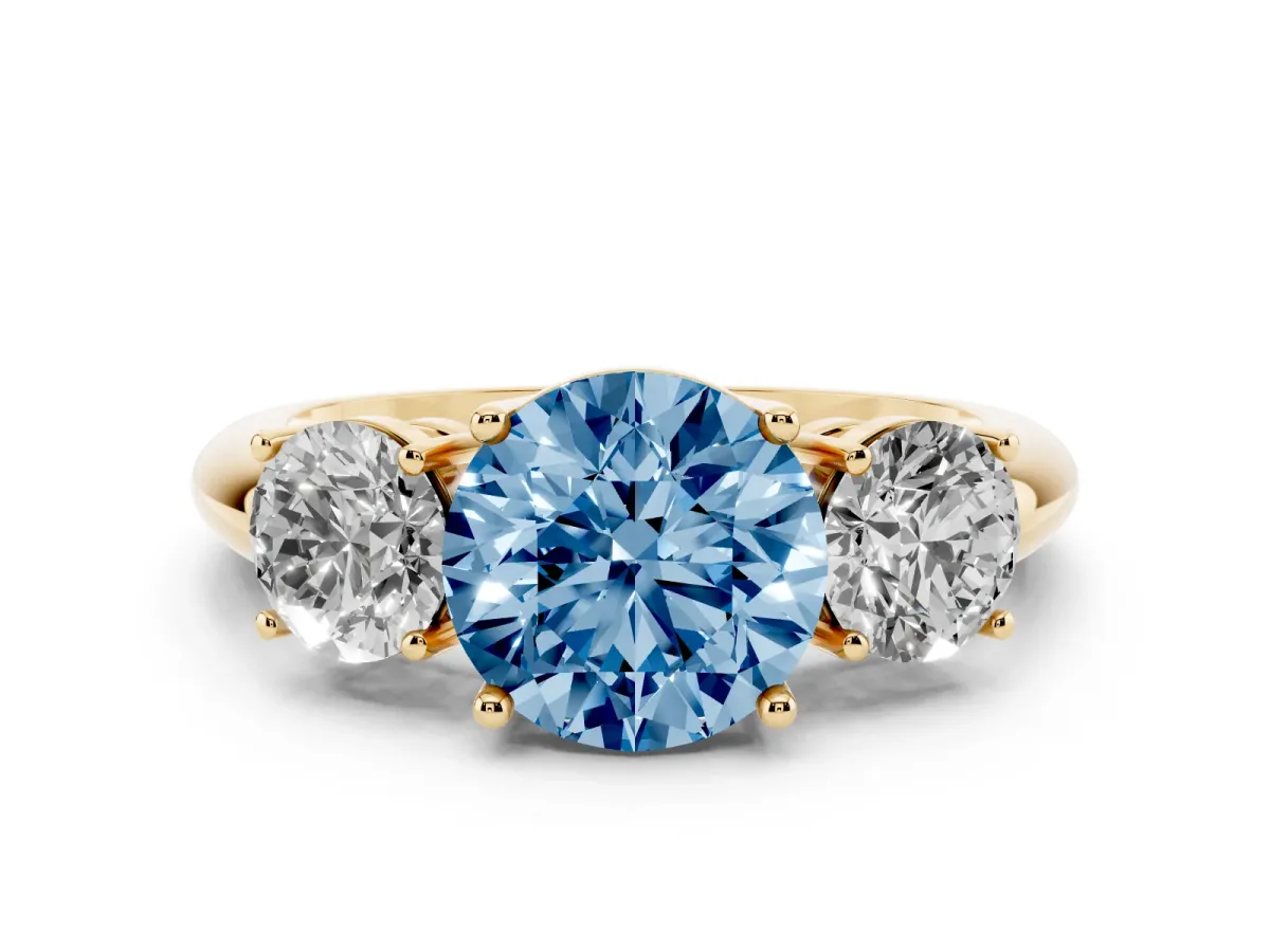 Fancy Blue Three-Stone Round Cut Cut Diamond Engagement Ring with Prong Setting on a White Gold Band Yellow gold