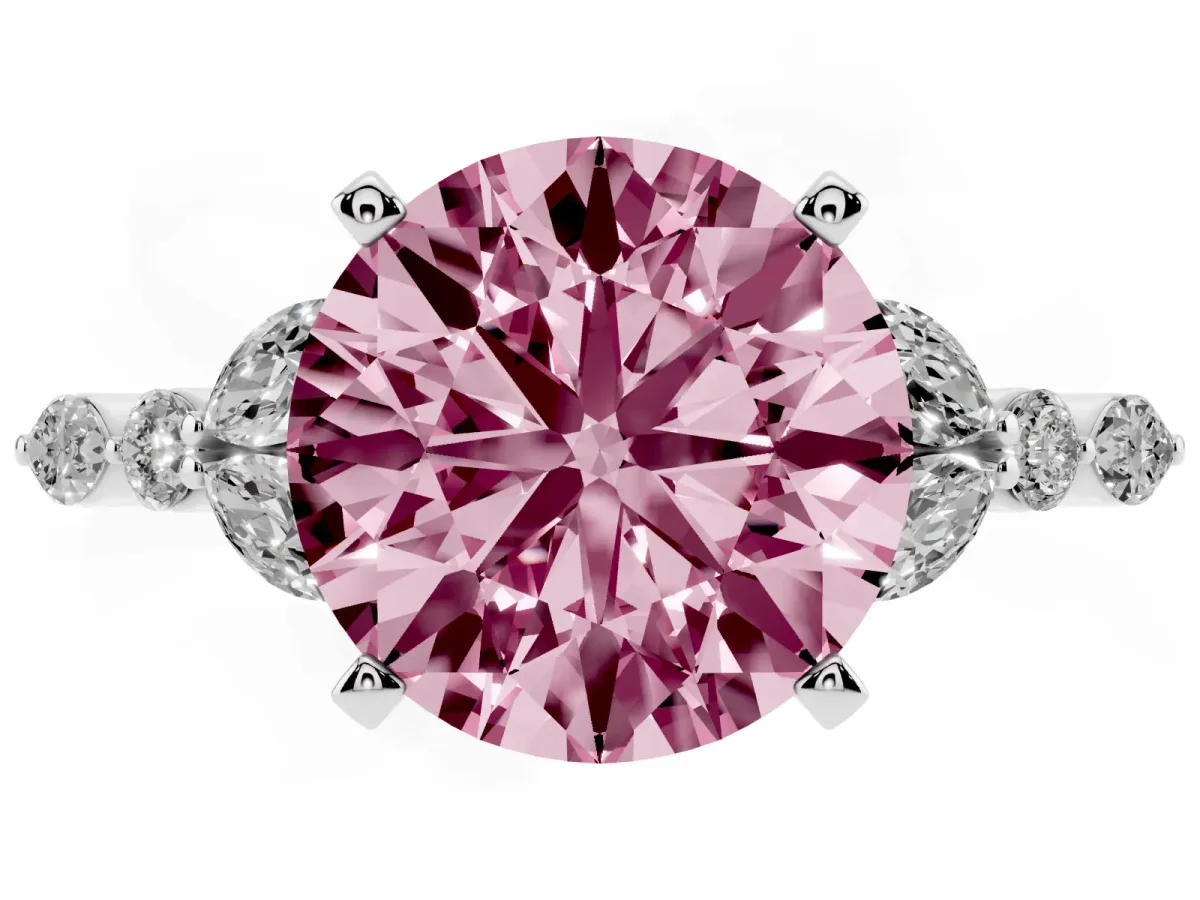 Fancy Pink Round Cut Diamond Solitaire Ring with Side Stones and Four-Prong Setting Platinum