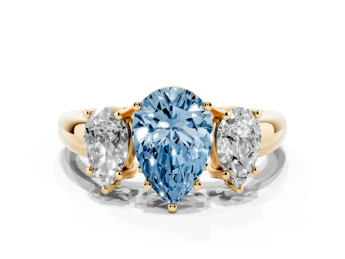 Fancy Blue Three-Stone Pear Cut Diamond Engagement Ring with Prong Setting Yellow gold