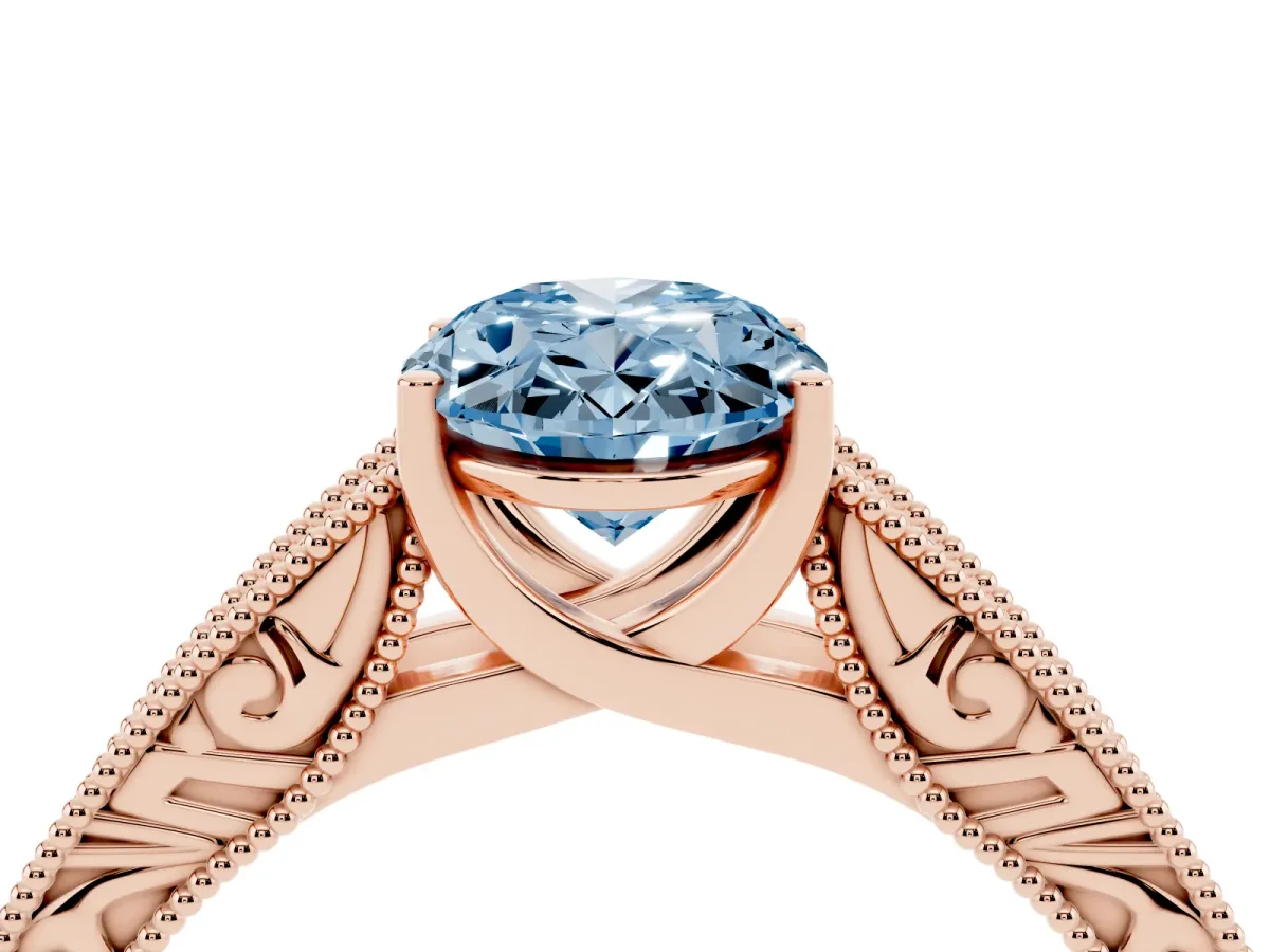 Fancy Blue Oval Cut Diamond Solitaire Ring with Engraved Band and Four-Prong Setting Rose gold