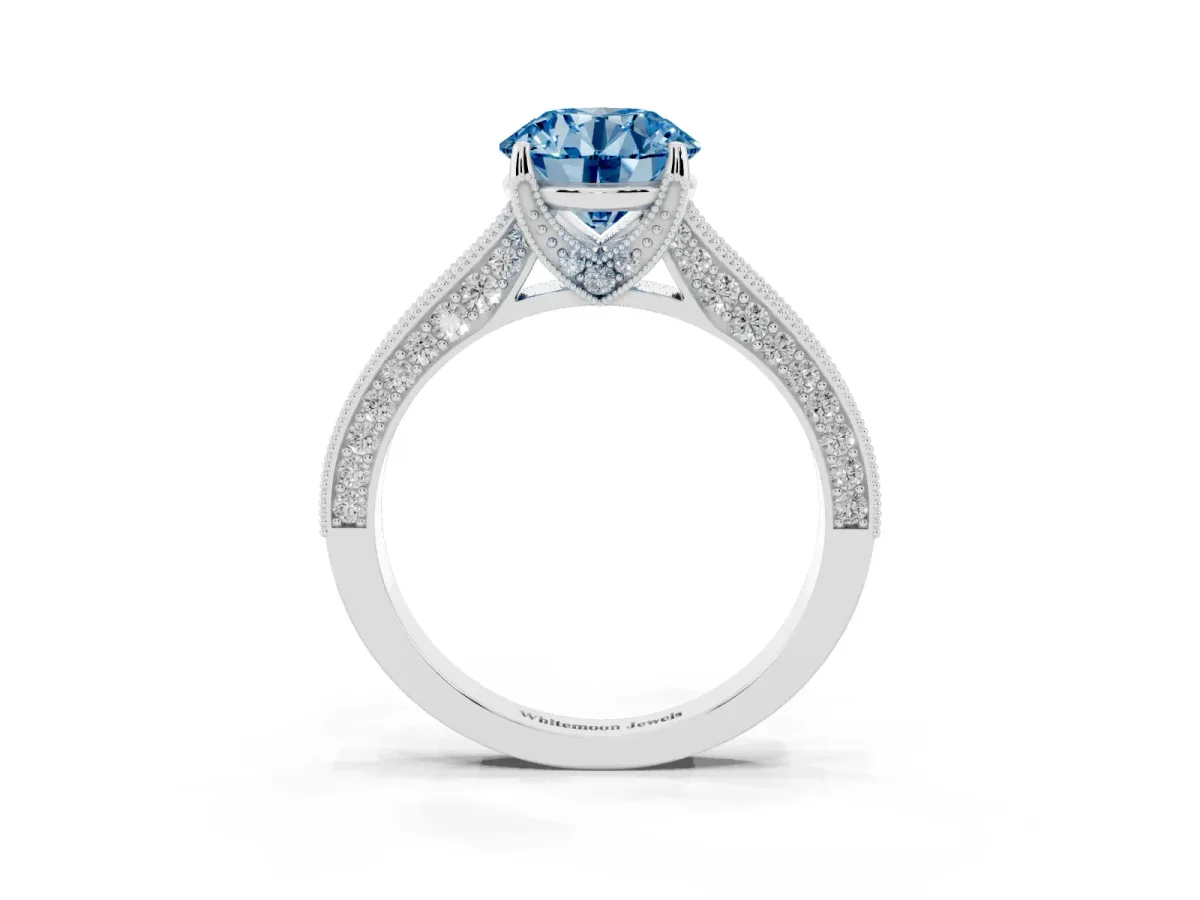 Fancy Blue Round Cut Cut Diamond Solitaire Ring with Milgrain Pave Band and Four Prong Setting Silver