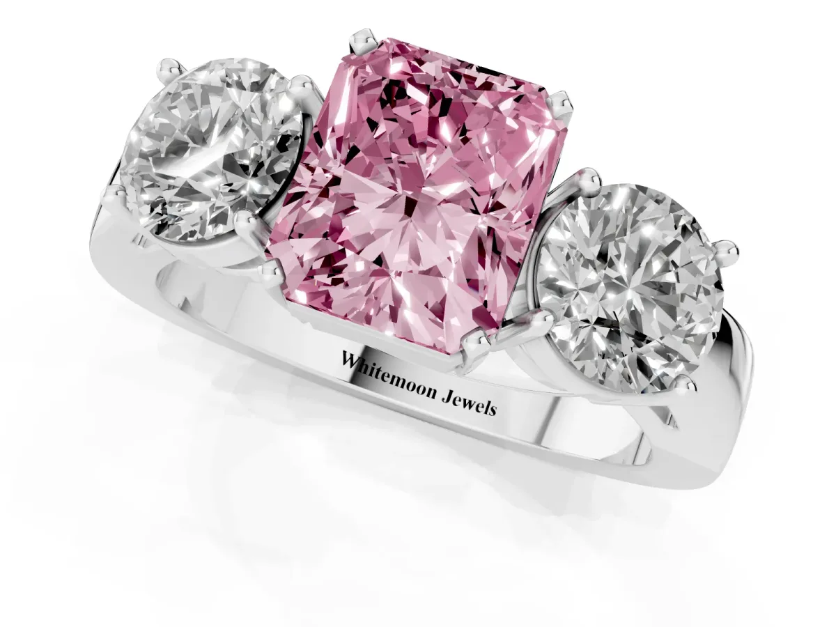 Fancy Pink Three-Stone Radiant Cut Diamond Ring with Round Side Stones, Classic Band, and Four-Prong Setting Silver