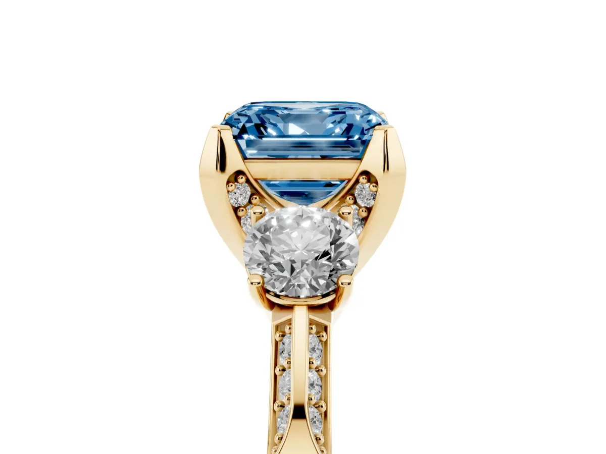 Fancy Blue Asscher Cut Brilliant Three-Stone Diamond Ring with Pavé Band and Four-Prong Setting Yellow gold