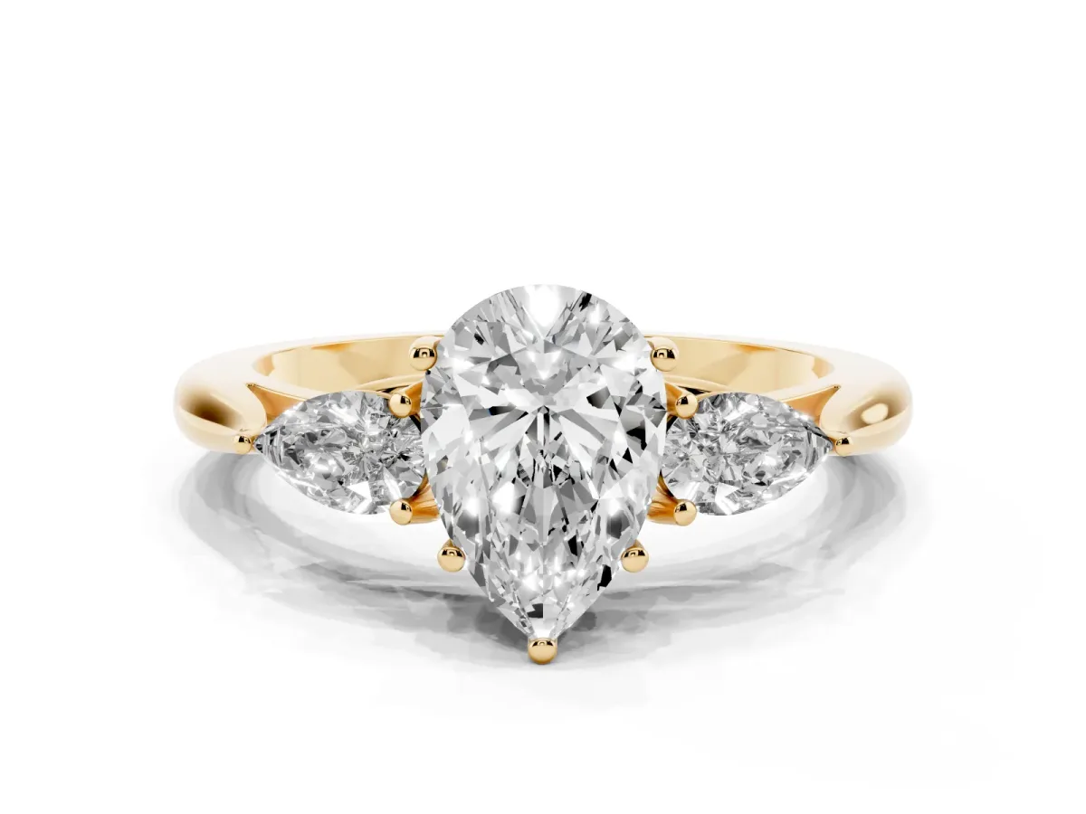 Three-Stone Pear Cut Diamond Ring with Pear Side Stones in Four-Prong Setting Yellow gold