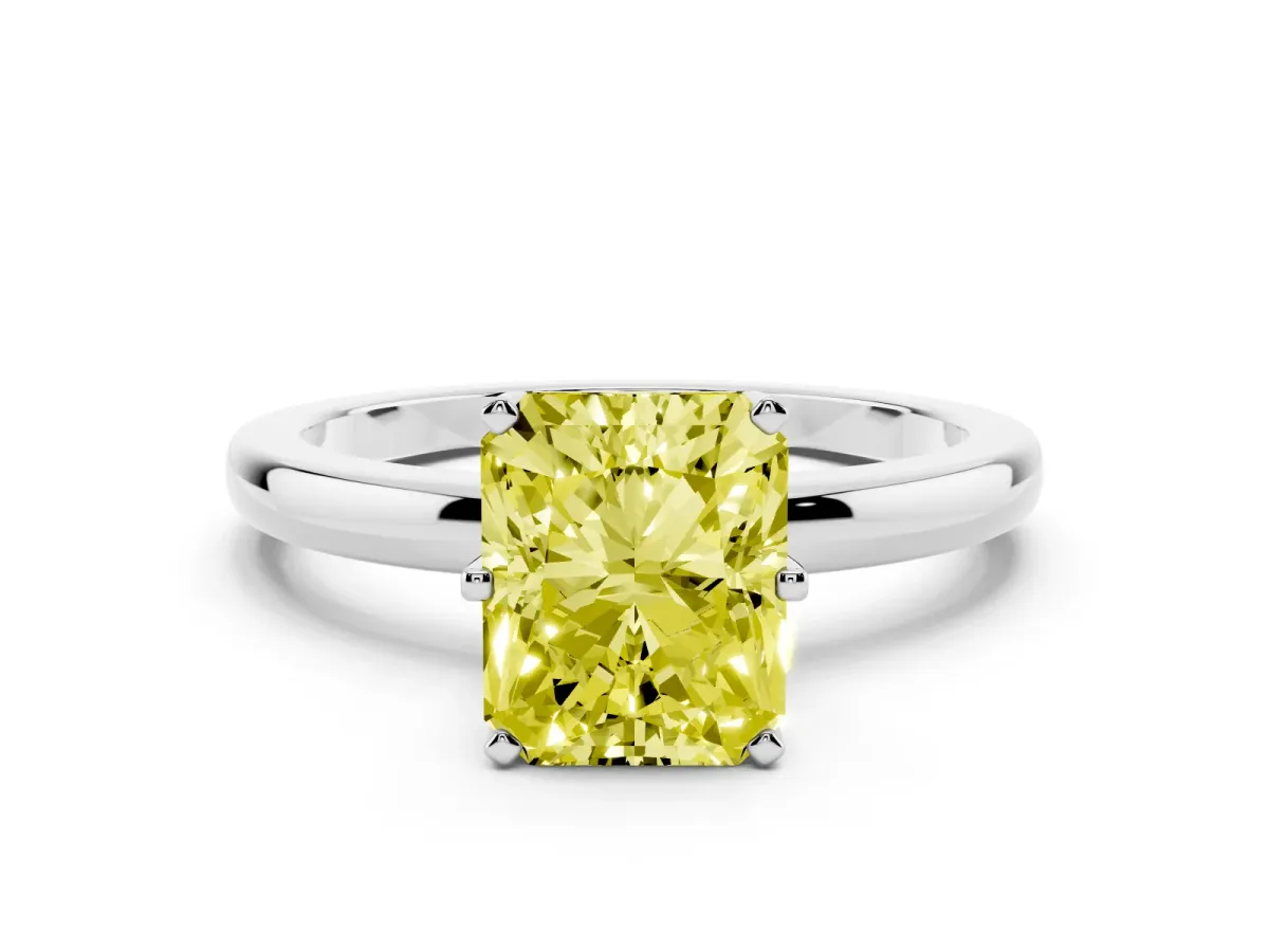 Fancy Yellow Radiant Cut Solitaire Diamond Ring with Six-Prong Setting on a Classic Band Silver