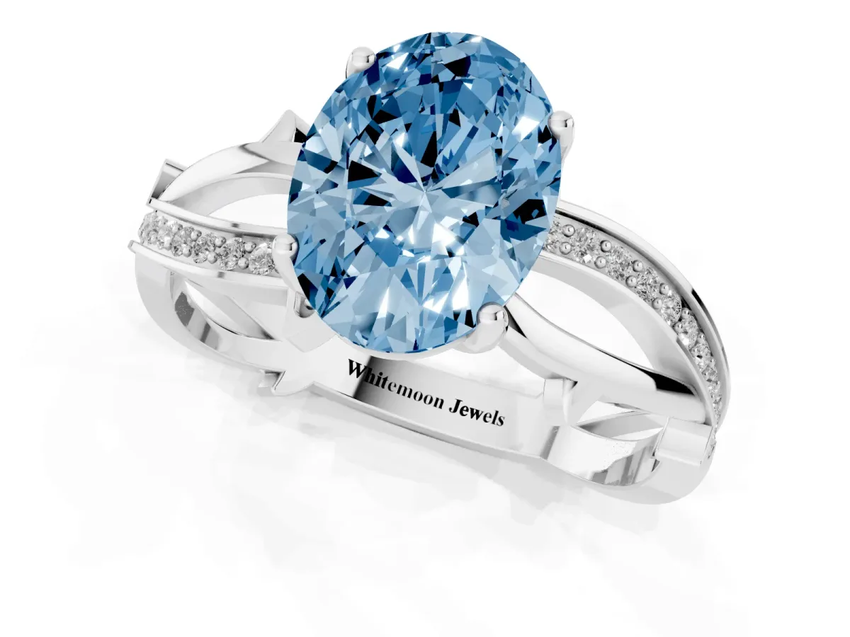 Fancy Blue Oval Cut Solitaire Twist Band with Pavé Accents and Four-Prong Setting White gold