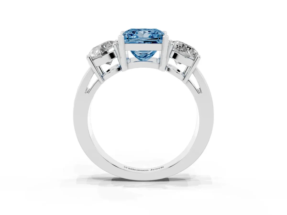 Fancy Blue Three-Stone Princess Cut Diamond Ring with Round Side Stones, Classic Band, and Four-Prong Setting White gold