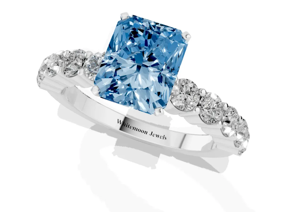 Fancy Blue Radiant Cut Diamond Solitaire Ring with Shared Prong Round Side Stones Platinum