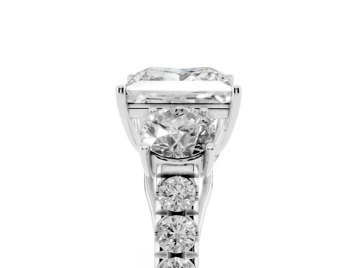 Princess Cut Cut Diamond Three-Stone Ring with Round Side Stones and Pavé Band Platinum