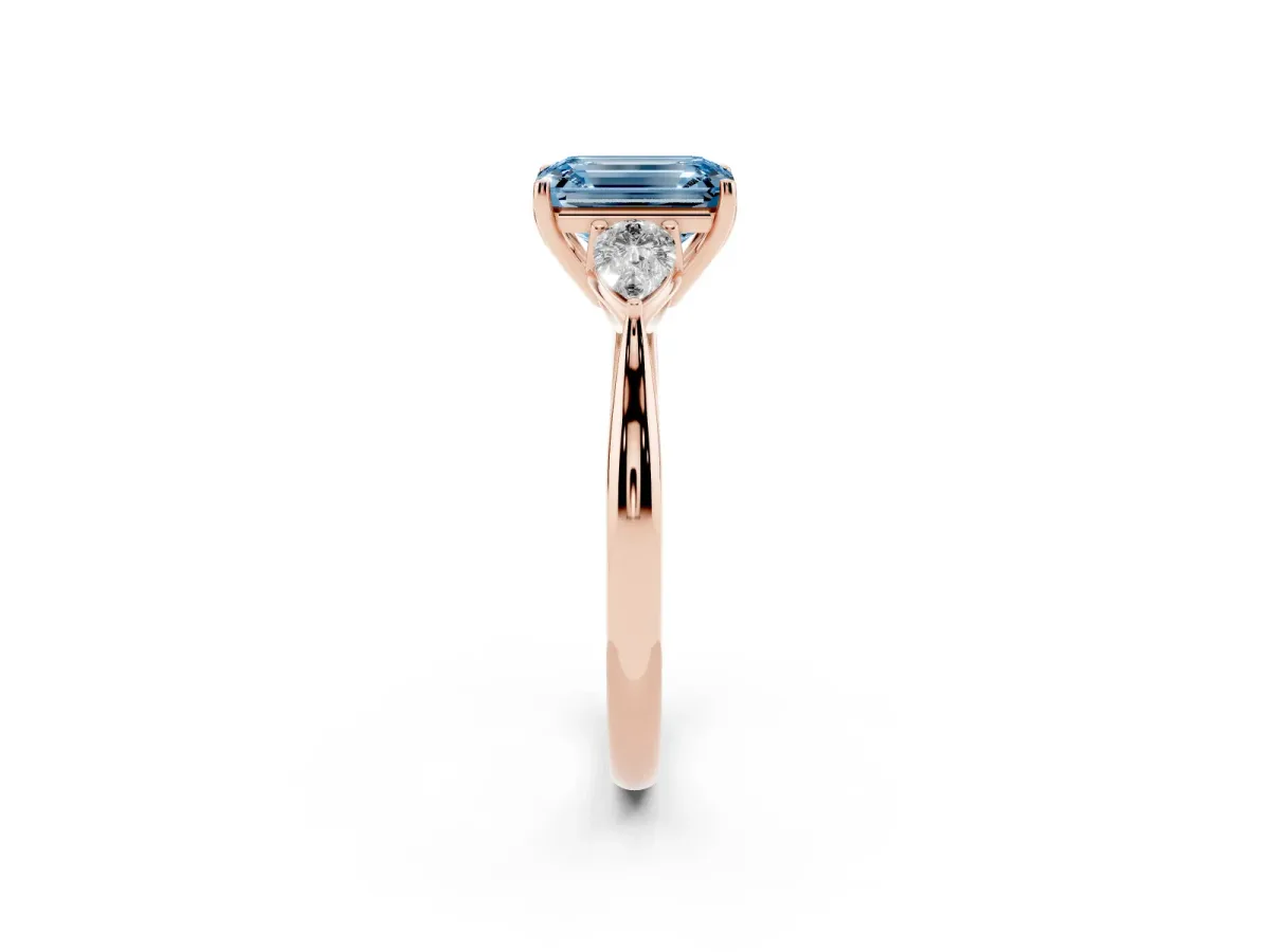 Fancy Blue Emerald Cut Diamond Three-Stone Ring with Pear Side Stones and Prong Setting Rose gold