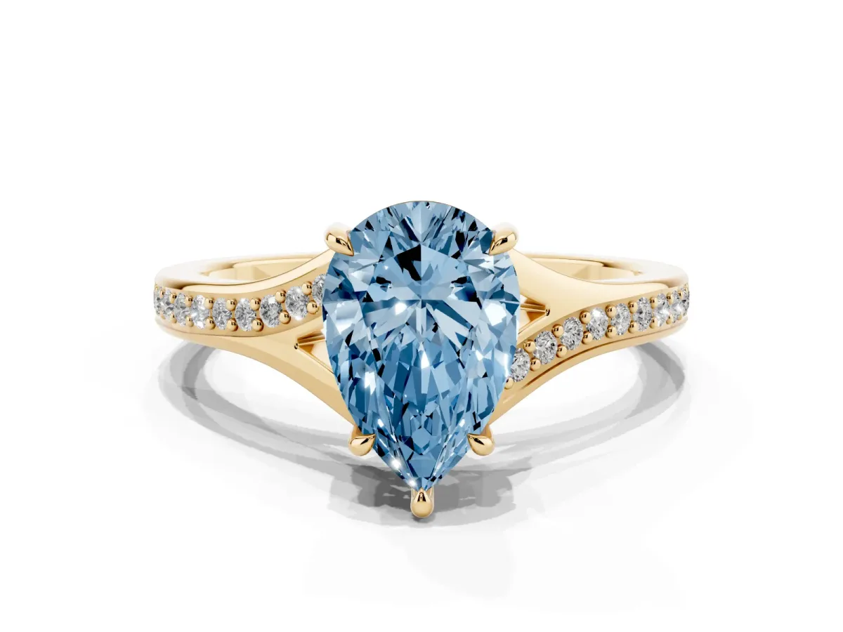 Fancy Blue Pear Cut Diamond Solitaire Ring with Pavé Band and Prong Setting Yellow gold