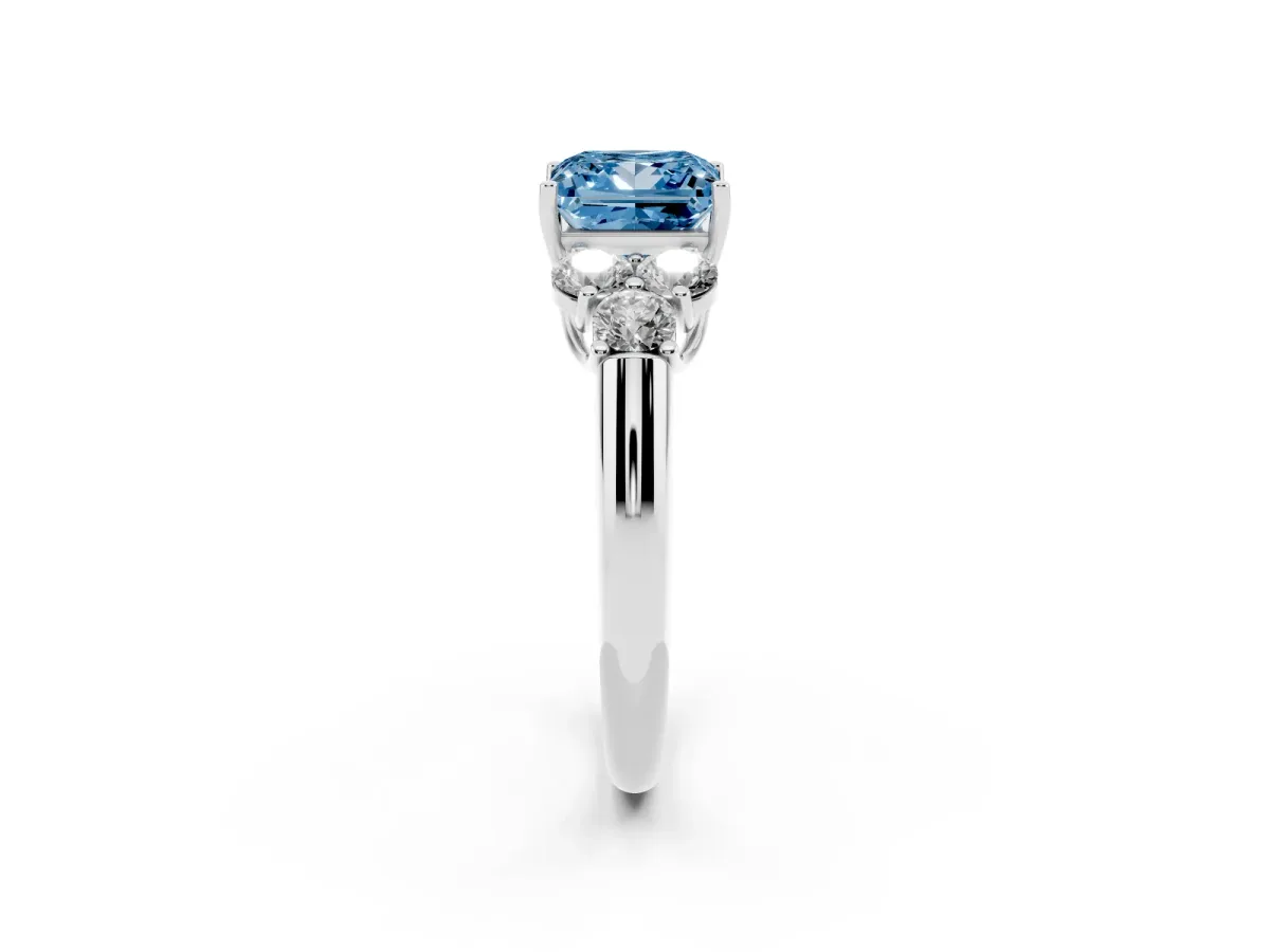Fancy Blue Princess Cut Cut Diamond Cluster Ring with Round Accent Stones and Prong Setting on a Classic Band Silver