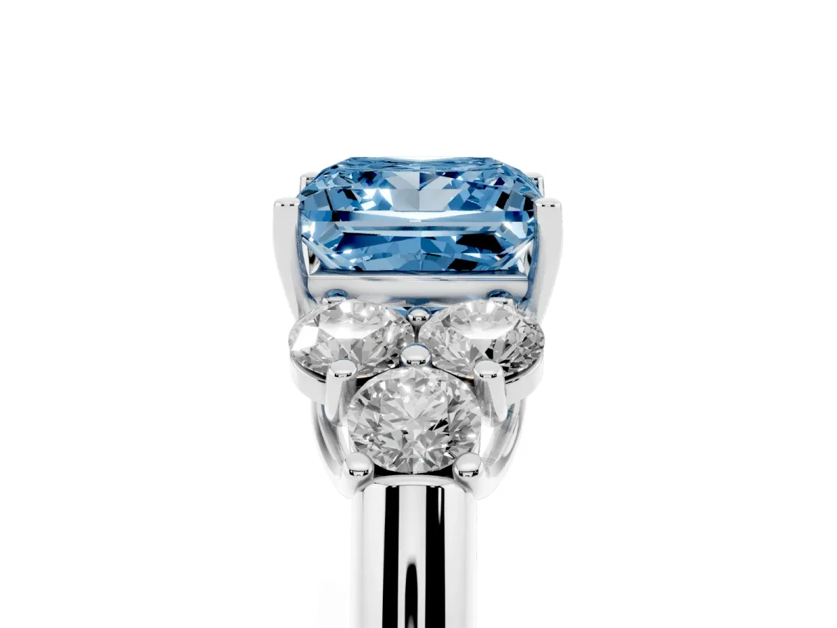Fancy Blue Princess Cut Cut Diamond Cluster Ring with Round Accent Stones and Prong Setting on a Classic Band Silver