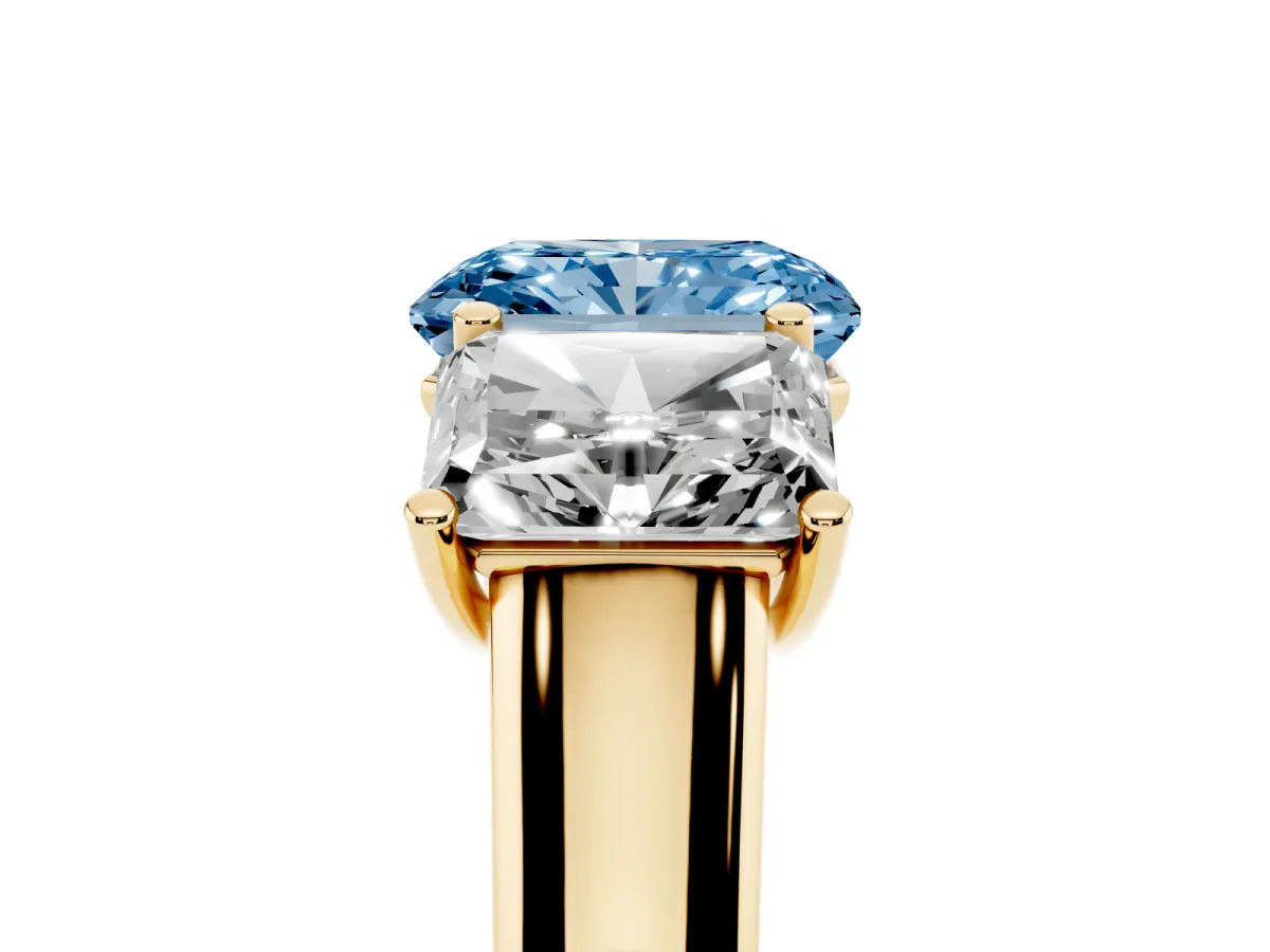 Fancy Blue Radiant Cut Three-Stone Diamond Ring with Prong Setting on a Classic Band Yellow gold