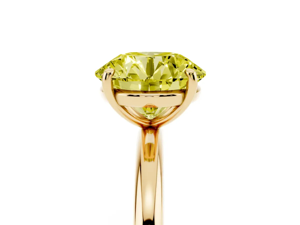 Fancy Yellow Round Cut Solitaire Diamond Ring with Four-Prong Setting on a Plain Band Yellow gold