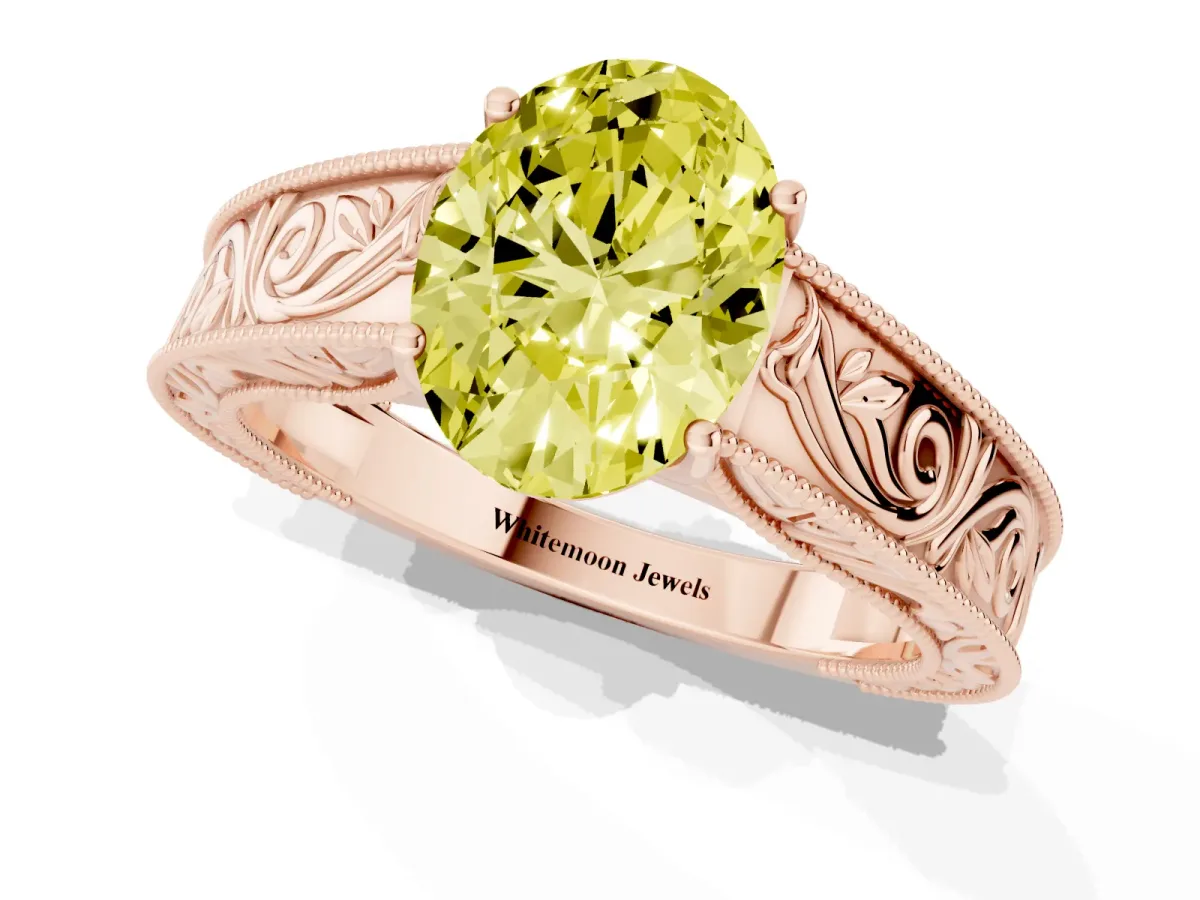 Fancy Yellow Oval Cut Diamond Solitaire Ring with Engraved Band and Four-Prong Setting Rose gold