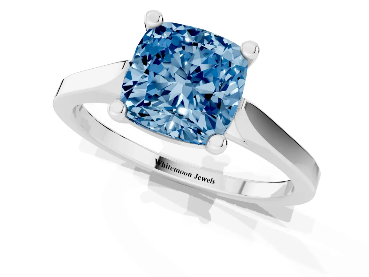 Fancy Blue Cushion Cut Solitaire Diamond Ring with Four-Prong Setting and Tapered Band Platinum