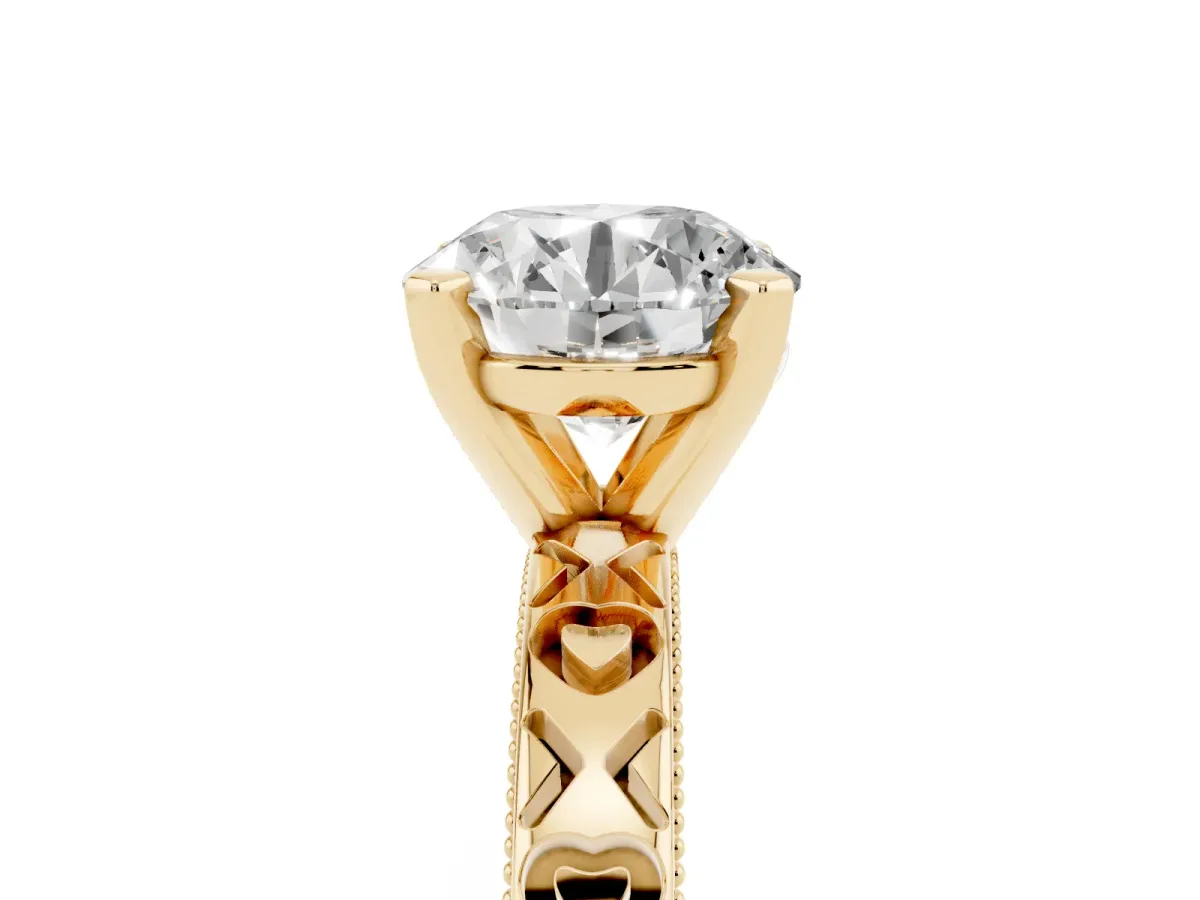 Round Cut Solitaire Diamond Engagement Ring with XO Engraved Band and Four-Prong Setting Yellow gold