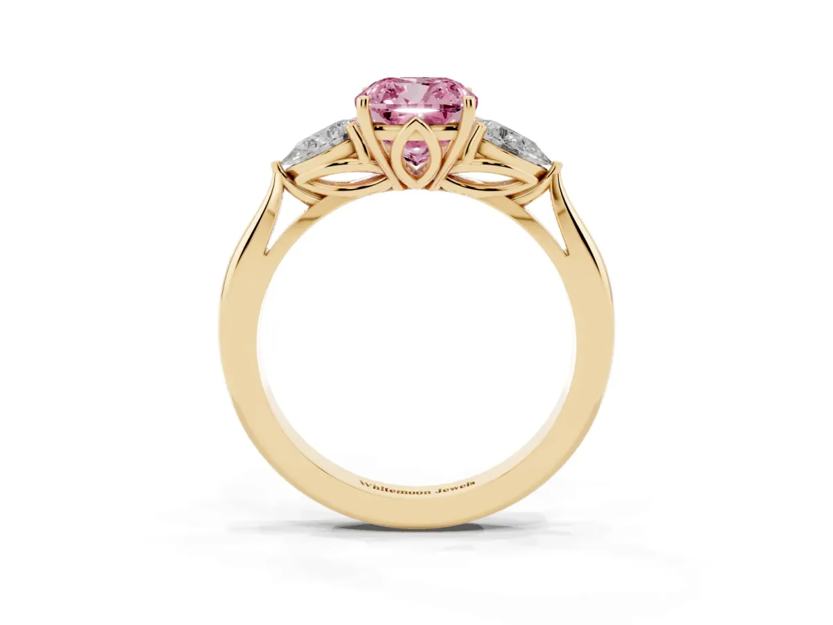 Fancy Pink Three-Stone Cushion Cut Diamond Ring with Pear Side Stones in Four-Prong Setting Yellow gold