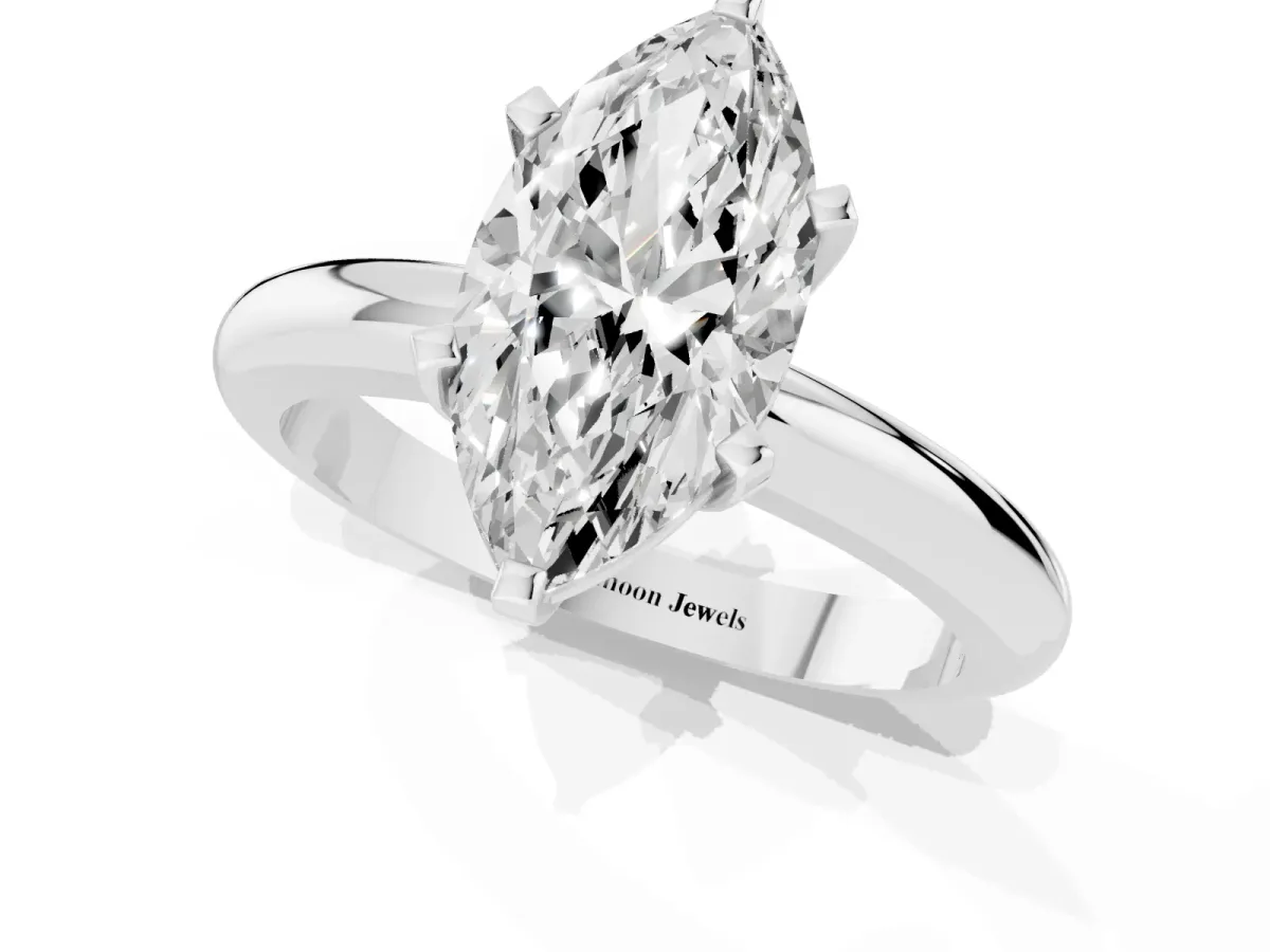 Marquise Cut Diamond Solitaire Engagement Ring with Round Band and Four-Prong Setting Platinum