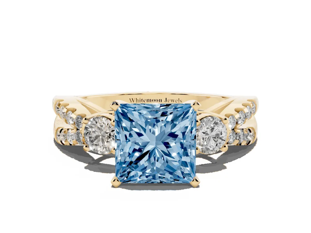 Fancy Blue Princess Cut Diamond Three-Stone Ring with Pavé Split Shank and Four-Prong Setting Yellow gold