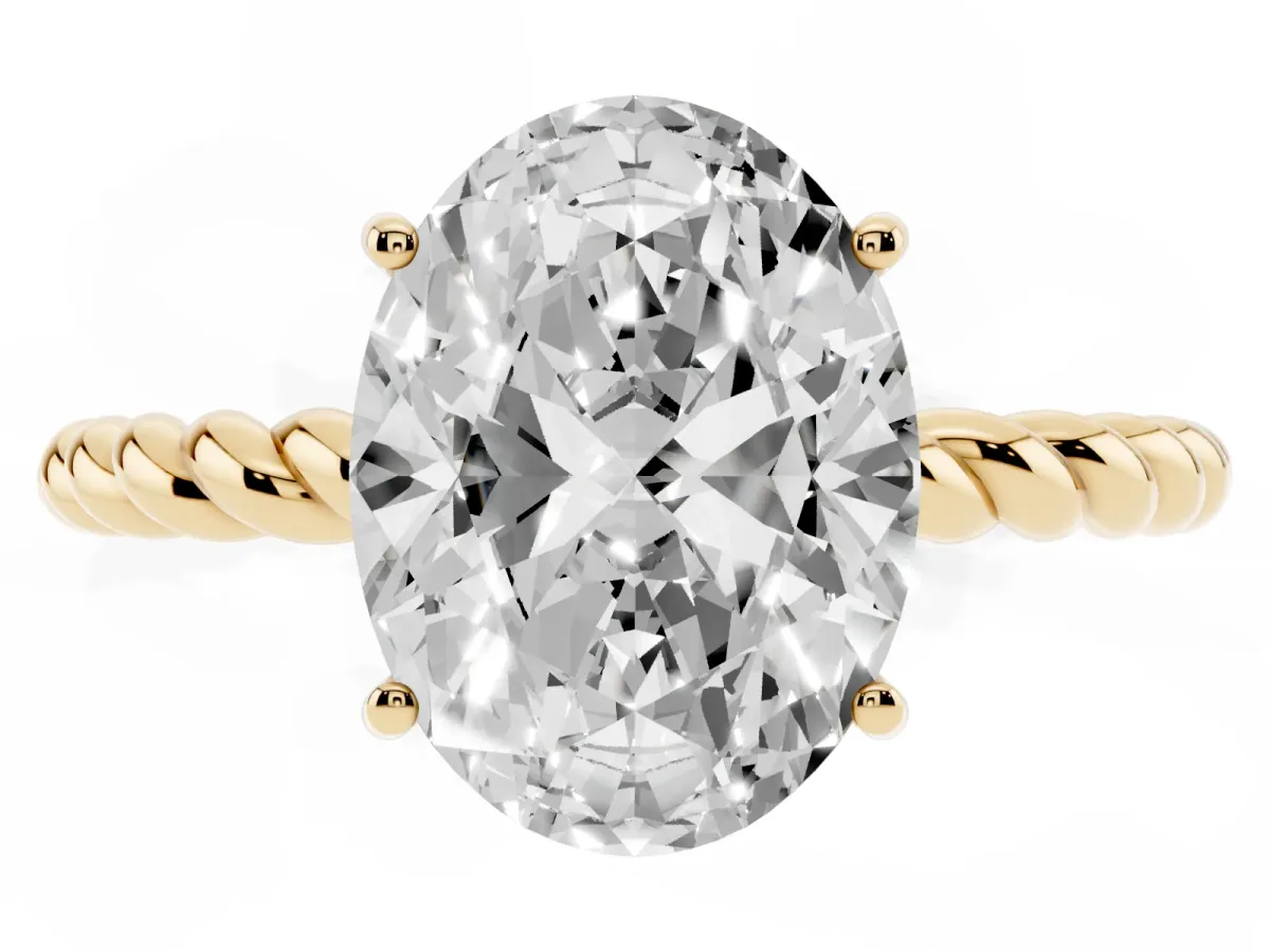 Oval Cut Solitaire Twist Band Ring with Four-Prong Setting Yellow gold