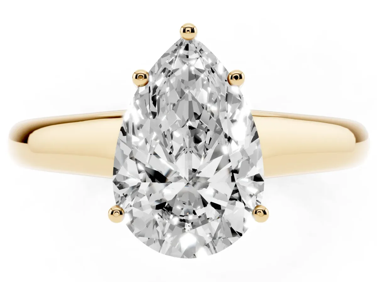 Pear Cut Solitaire Engagement Ring with Tapered Band and Four-Prong Setting Yellow gold