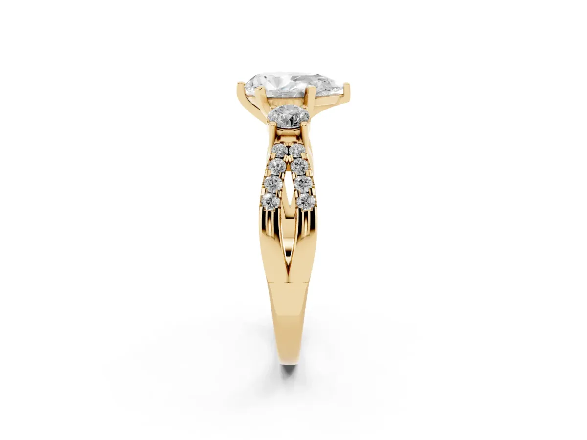 Pear Cut Diamond Three-Stone Ring with Pavé Split Shank and Four-Prong Setting Yellow gold