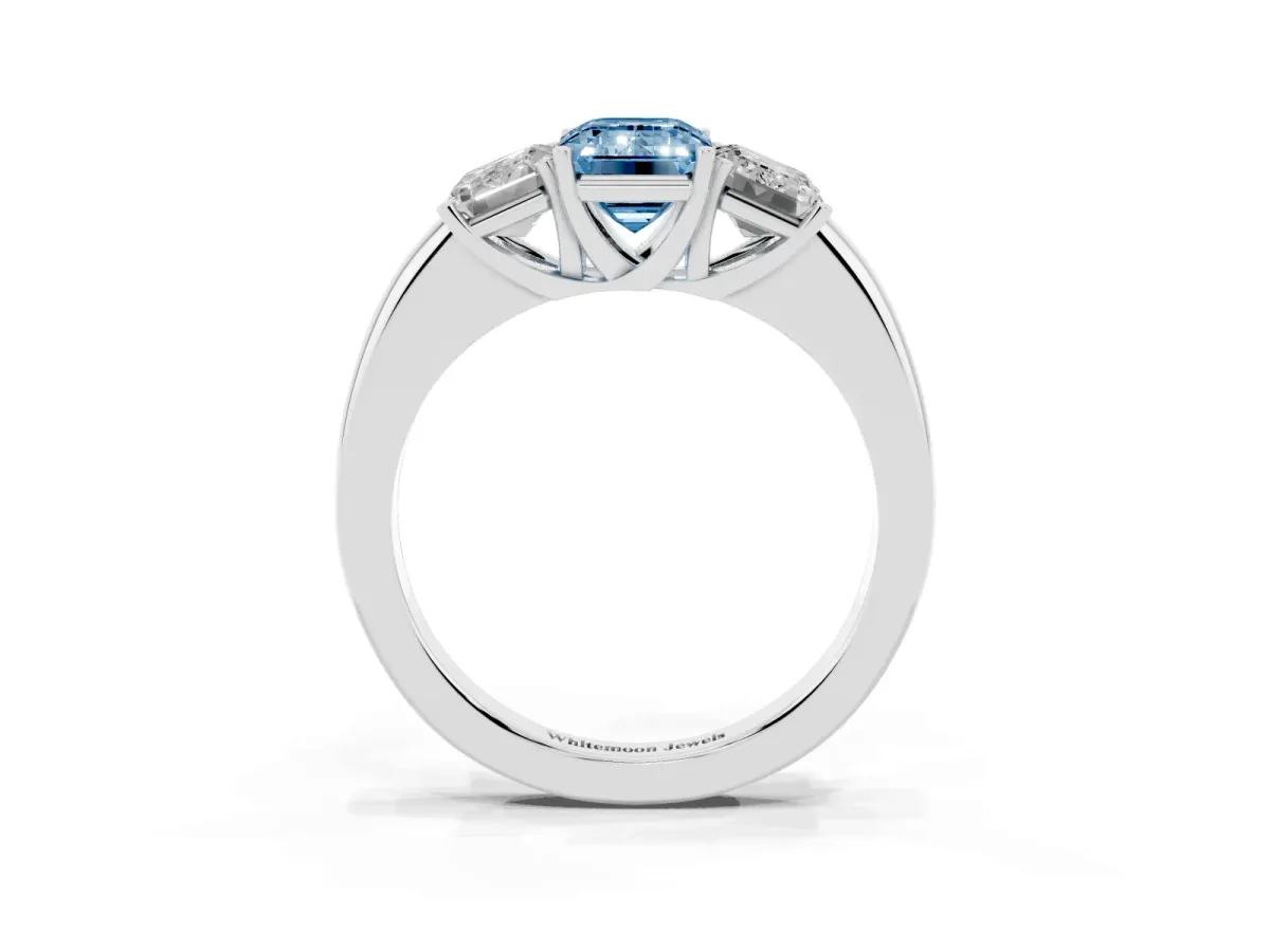 Fancy Blue Emerald Cut Diamond Three-Stone Ring with Four-Prong Setting and Classic Band Platinum