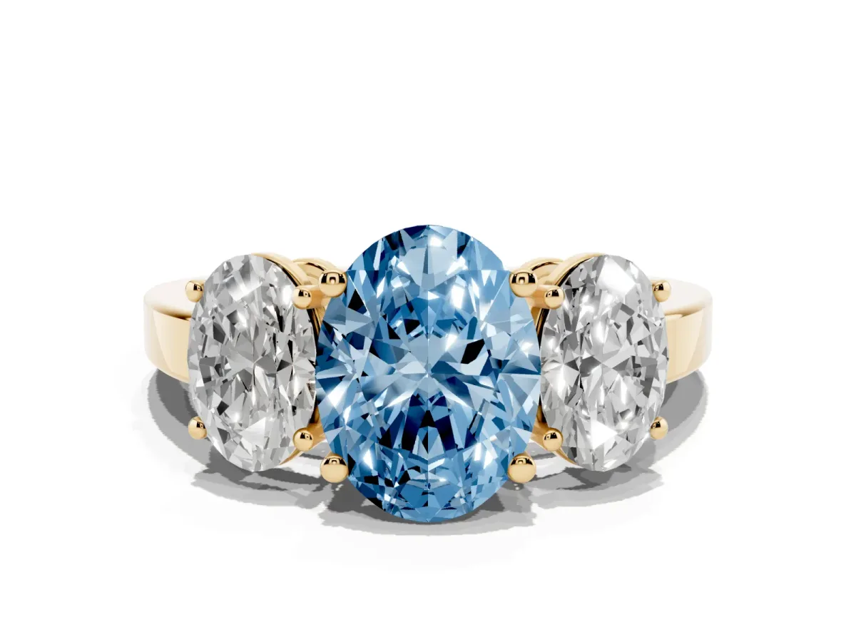 Fancy Blue Three-Stone Oval Cut Cut Diamond Engagement Ring with Flat Band and Four-Prong Setting Yellow gold