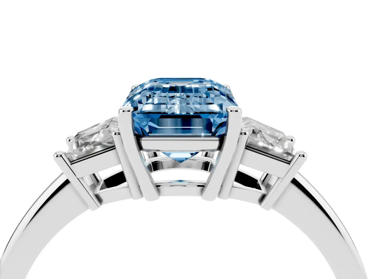 Fancy Blue Emerald Cut Diamond Three-Stone Ring with Trapezoid Side Stones and Prong Setting Platinum