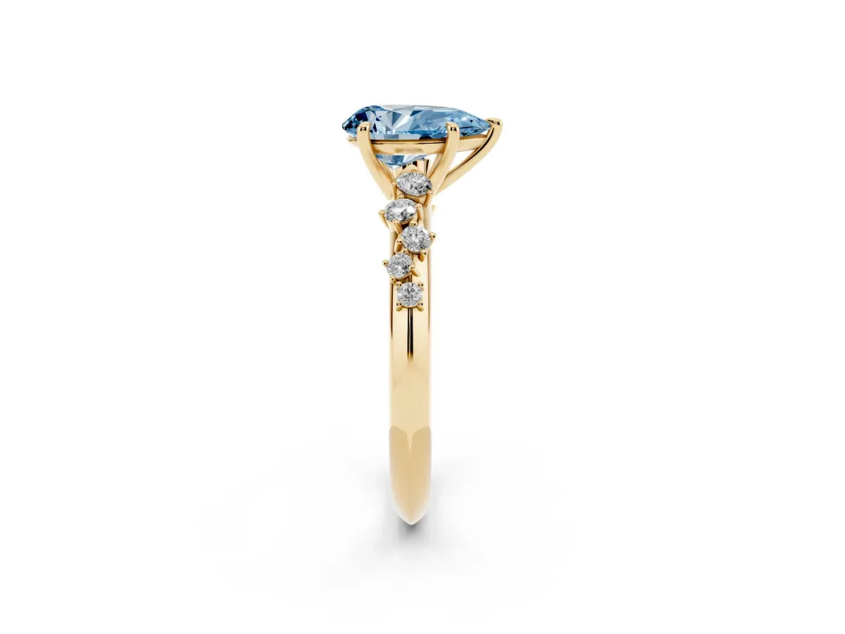 Fancy Blue Pear Cut Diamond Cluster Side Stone Solitaire Ring with Prong Setting Yellow gold