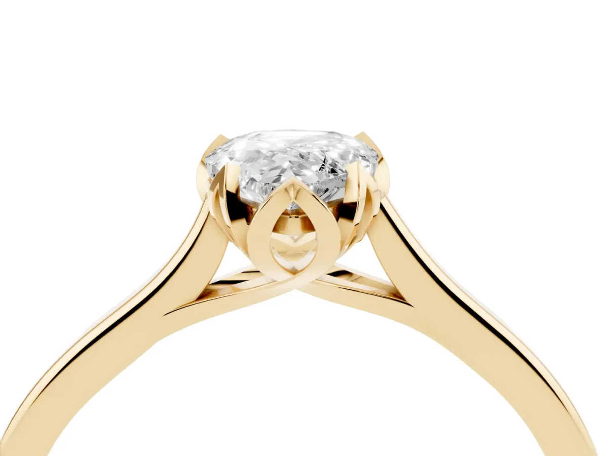 Pear Cut Diamond Solitaire Ring with Flower Prong Setting and Classic Band Yellow gold