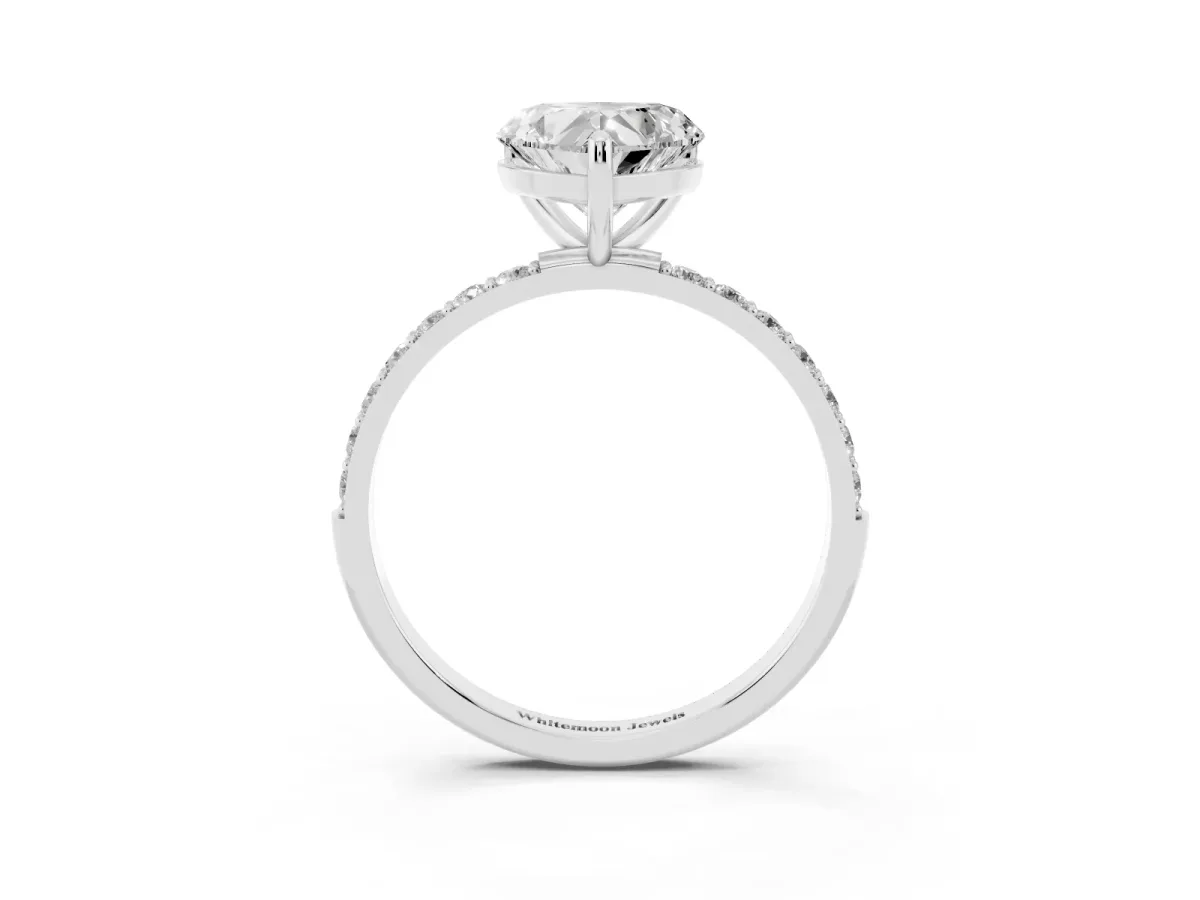 Heart Cut Diamond Solitaire Ring with Round Pavé Band and Prong Setting Silver