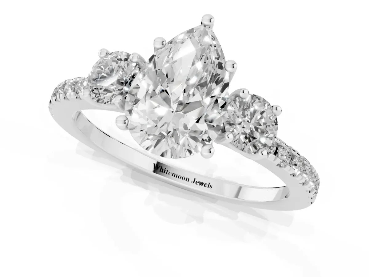 Three-Stone Pear Cut Cut Diamond Pavé Band with Prong Setting Platinum
